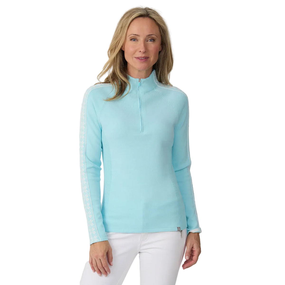 A woman wearing a light blue Krimson Klover Women's Slalom Zip Neck Sweater with white snowflake jacquard sleeve details and a quarter zip front.
