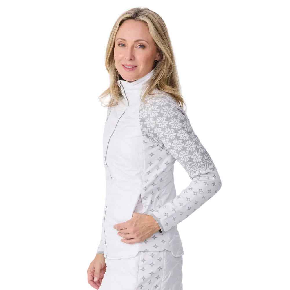 Side view of a white Krimson Klover Women’s Switchback Sierra Jacket featuring a quilted insulated core, patterned knit stretch sleeves, full front zipper, and zippered hand pockets.