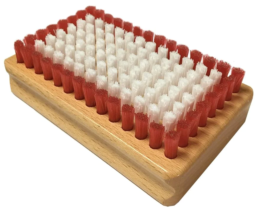 A Kuu Nylon Brush showing a rectangular wooden handle block set with dense synthetic bristle tufts arranged in uniform rows.