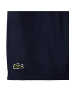 Lacoste Boys Sport Diamond Weave Shorts featuring lightweight breathable fabric, athletic fit, elastic waistband, and crocodile branding.