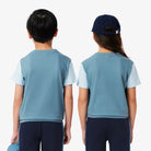 Lacoste Kids Cotton Colorblock T-Shirt featuring soft cotton fabric, colourblock styling, comfortable fit, and crocodile branding.