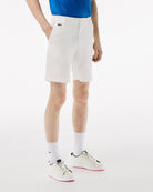 Lacoste Men's Bermuda golf shorts with breathable stretch performance fabric and tailored fit for golf and everyday wear