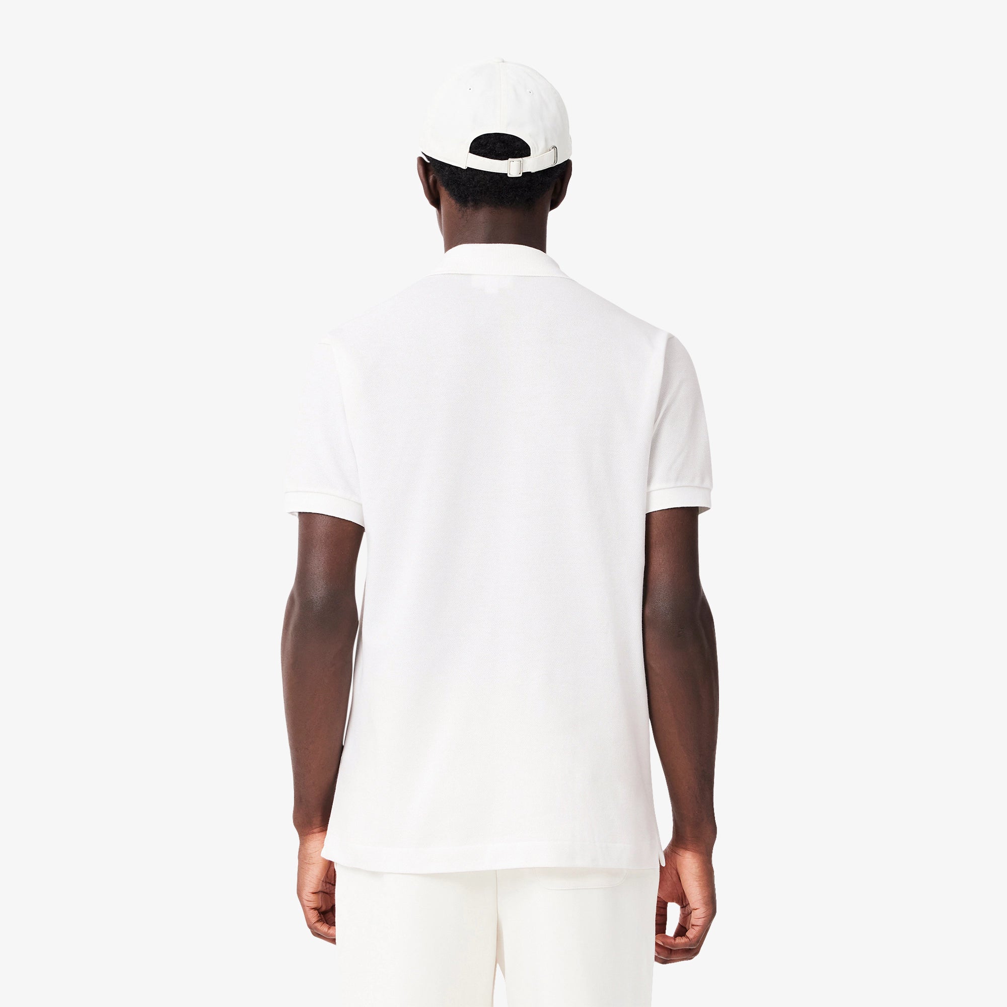 Lacoste Men's Classic Fit L.12.12 golf polo in signature petit piqué fabric with embroidered crocodile logo and timeless styling for golf wear