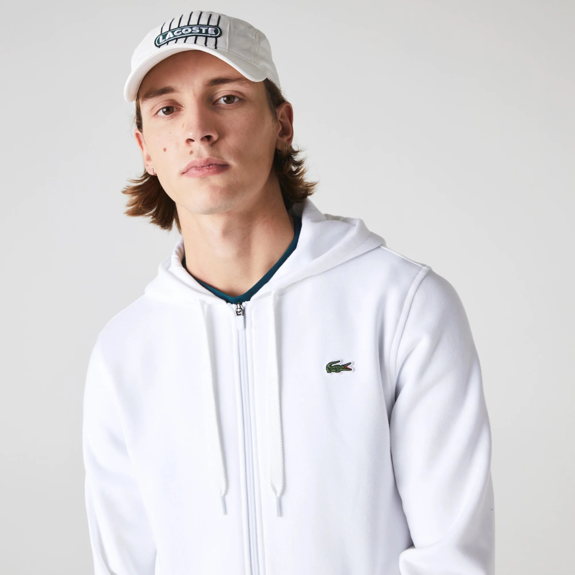 Lacoste Men's French Terry Zip-Up Sweatshirt featuring soft French terry fabric, full-zip design, side pockets, and crocodile branding.
