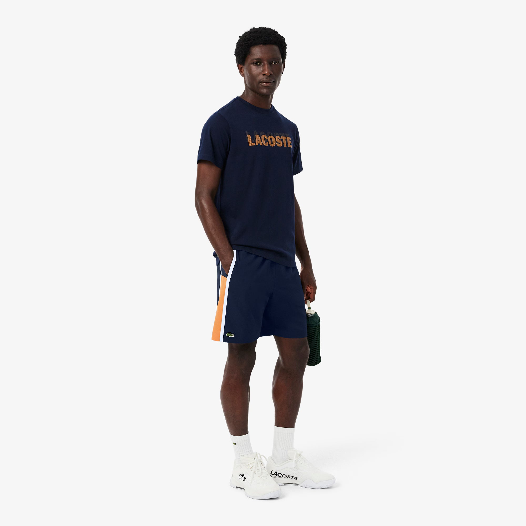 Lacoste Men's Lightweight Colourblock Tennis Shorts featuring lightweight performance fabric, colourblock styling, and breathable athletic comfort.