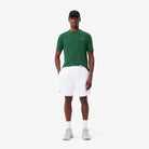 Lacoste Men's Lightweight Tennis Shorts featuring breathable performance fabric, side pockets, athletic fit, and crocodile branding.