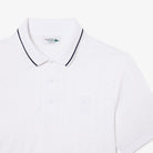 Lacoste Men's Tennis Heritage Ultra Dry Stretch Polo featuring moisture-wicking stretch fabric, heritage styling, and embroidered crocodile branding.