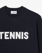 Lacoste Men's Tennis Knit Crew Neck Sweater featuring premium knit fabric, ribbed detailing, classic styling, and crocodile branding.