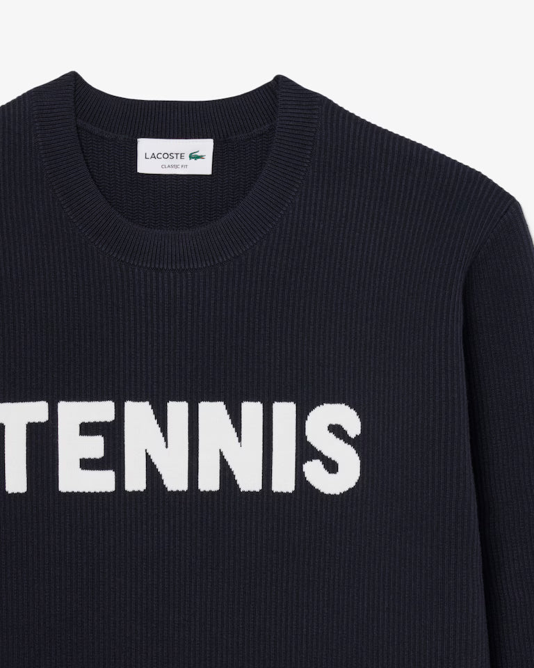 Lacoste Men's Tennis Knit Crew Neck Sweater featuring premium knit fabric, ribbed detailing, classic styling, and crocodile branding.