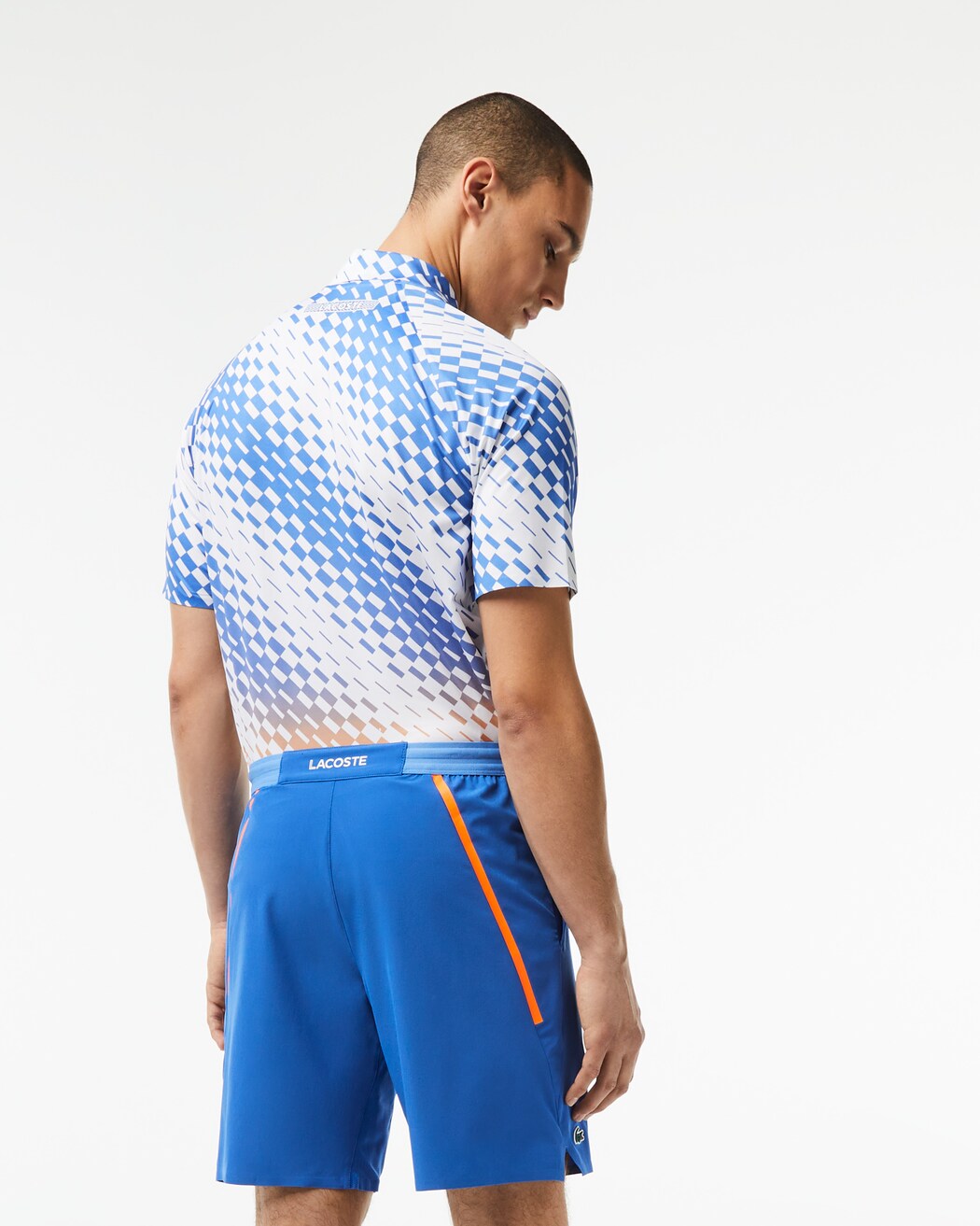 Lacoste Men's Tennis x Novak Djokovic Taffeta Shorts featuring lightweight performance fabric, athletic fit, side pockets, and signature branding.