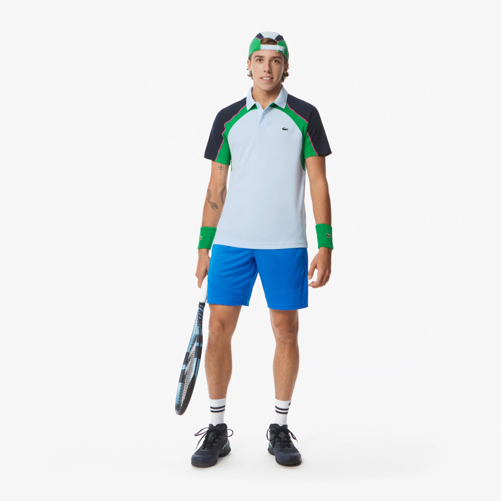 Lacoste Men's Ultra Dry Colorblock Tennis Polo featuring moisture-wicking performance fabric, colorblock detailing, athletic fit, and crocodile branding.