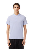 Lacoste Men's Ultralight Piqué Movement Polo featuring lightweight breathable fabric, stretch comfort, and signature crocodile branding.