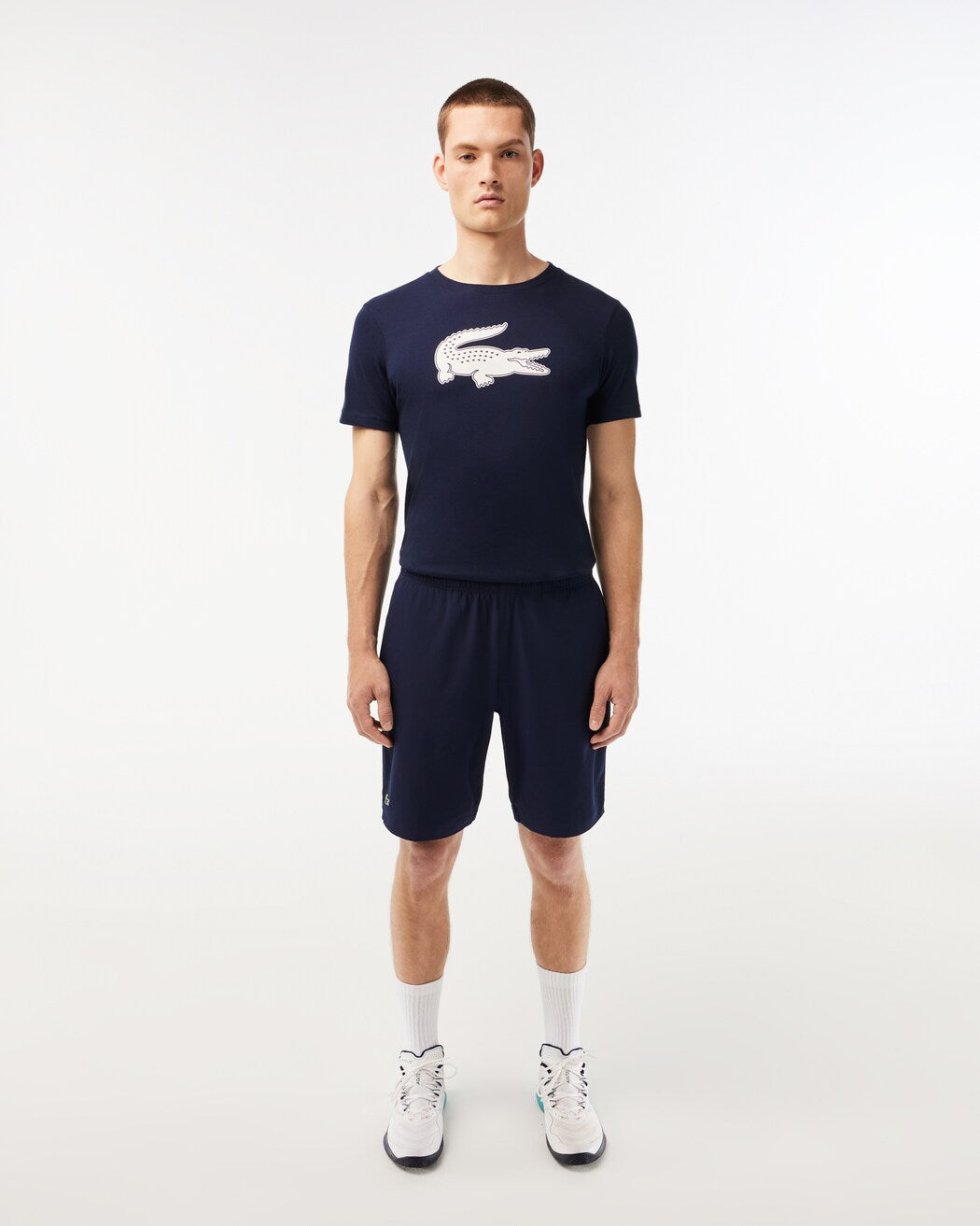 Lacoste Men's Ultralight Tennis Shorts featuring lightweight performance fabric, moisture management, side pockets, and an athletic fit.