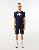 Lacoste Men's Ultralight Tennis Shorts featuring lightweight performance fabric, moisture management, side pockets, and an athletic fit.
