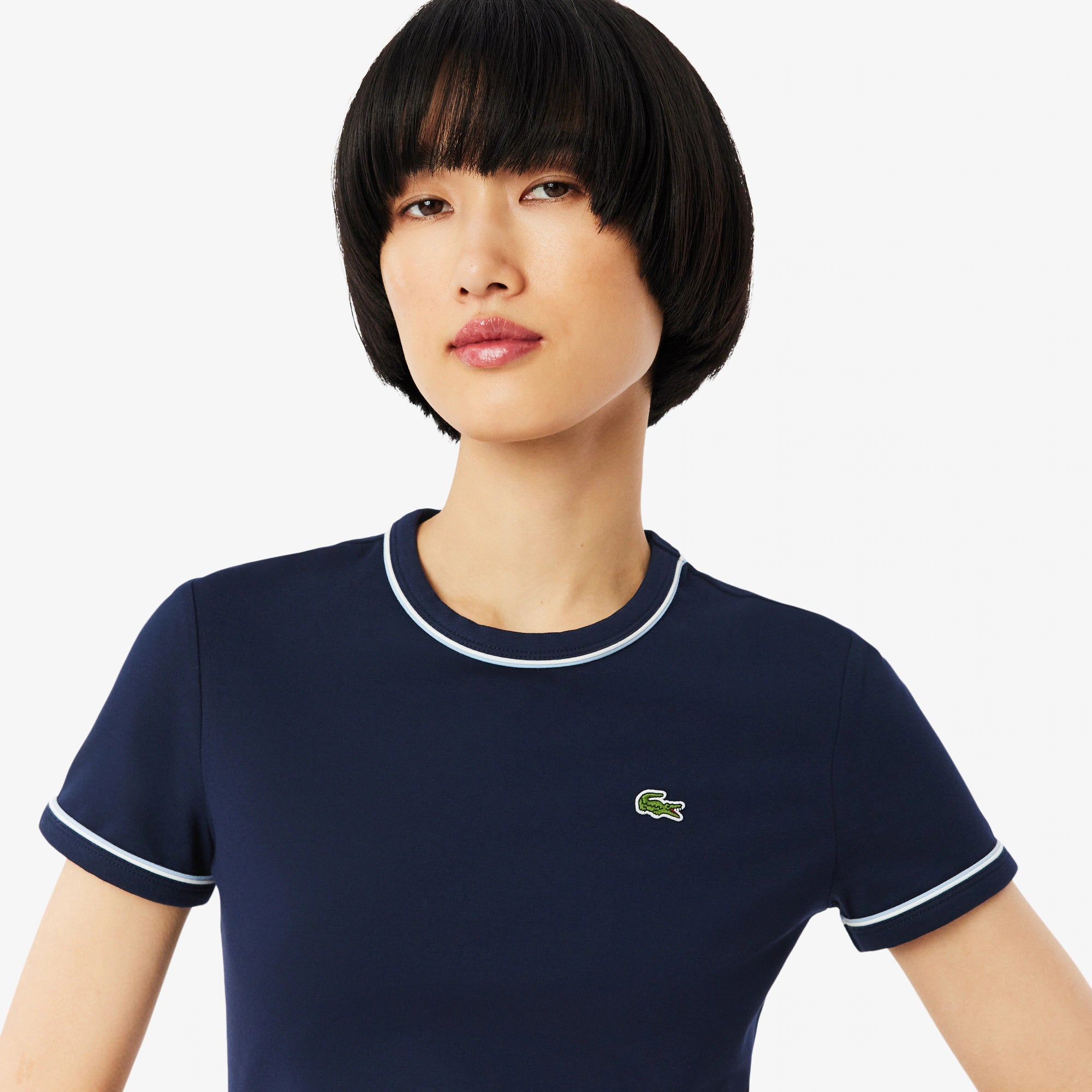 Lacoste Women's Contrast Trim Jersey Tee featuring soft jersey fabric, contrast detailing, breathable comfort, and crocodile branding.
