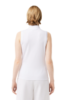 Lacoste Women's Slim Fit sleeveless golf polo with breathable performance fabric and iconic crocodile logo for golf and active wear