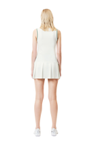 Lacoste Women's Sport Dress with Removable Piqué Shorts featuring lightweight performance fabric, removable shorts, athletic styling, and crocodile branding.