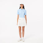 Lacoste Women's Ultra Dry Lined golf skirt with built-in shorts, stretch performance fabric, and moisture-management technology for golf wear