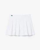 Lacoste Women's Ultra Dry Lined Tennis Skirt featuring moisture-wicking fabric, integrated liner, athletic silhouette, and crocodile branding.