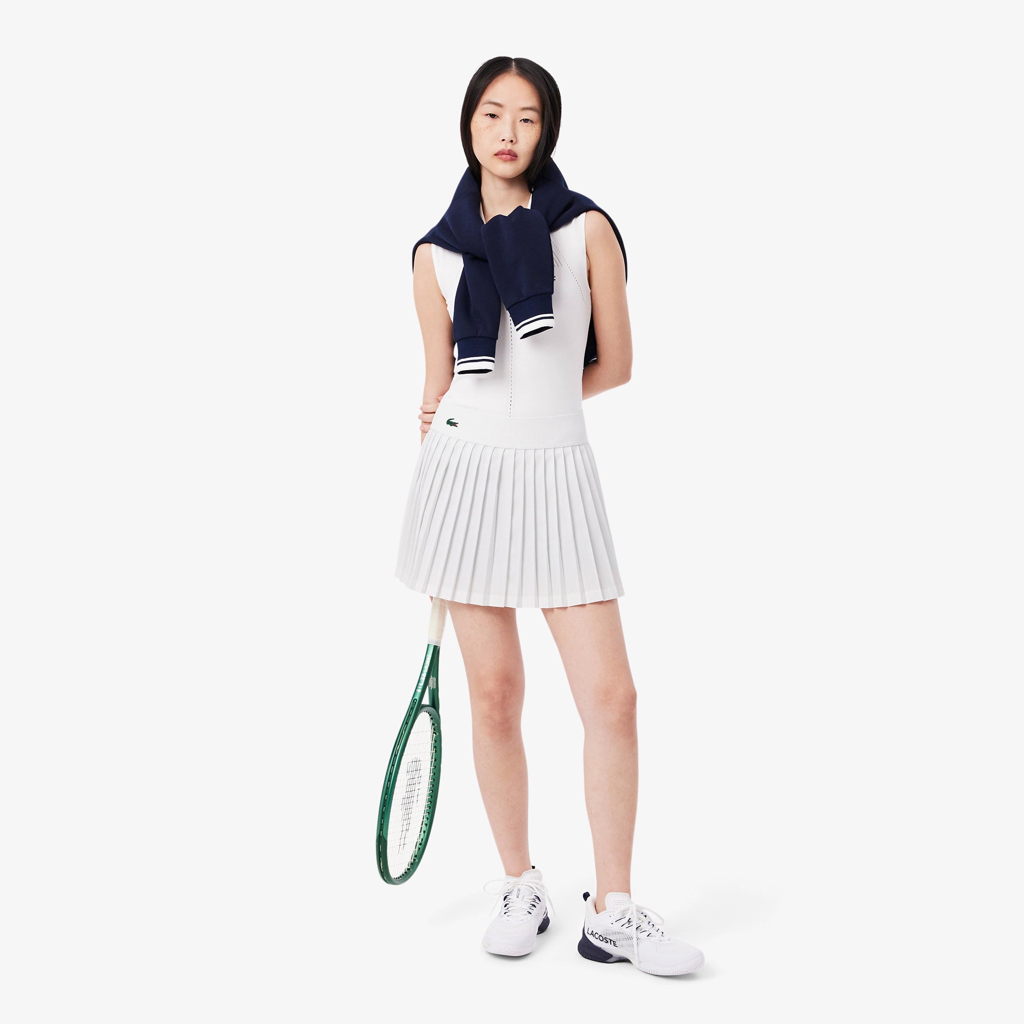 Lacoste Women's Ultra Dry Lined Tennis Skirt featuring stretch performance fabric, integrated liner, moisture management, and crocodile branding.