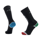A pair of black Le Bent Kids' Core Light Cushion Ski Socks that are made from a bamboo and merino wool blend.