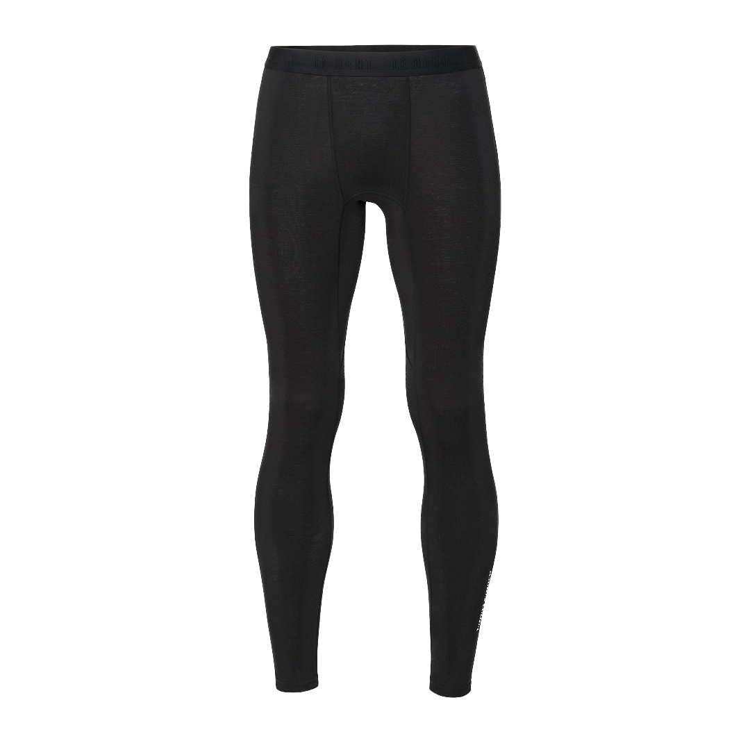 A pair of black Le Bent Men's Core Lightweight Baselayer Bottoms that are made from a bamboo and merino wool blend.