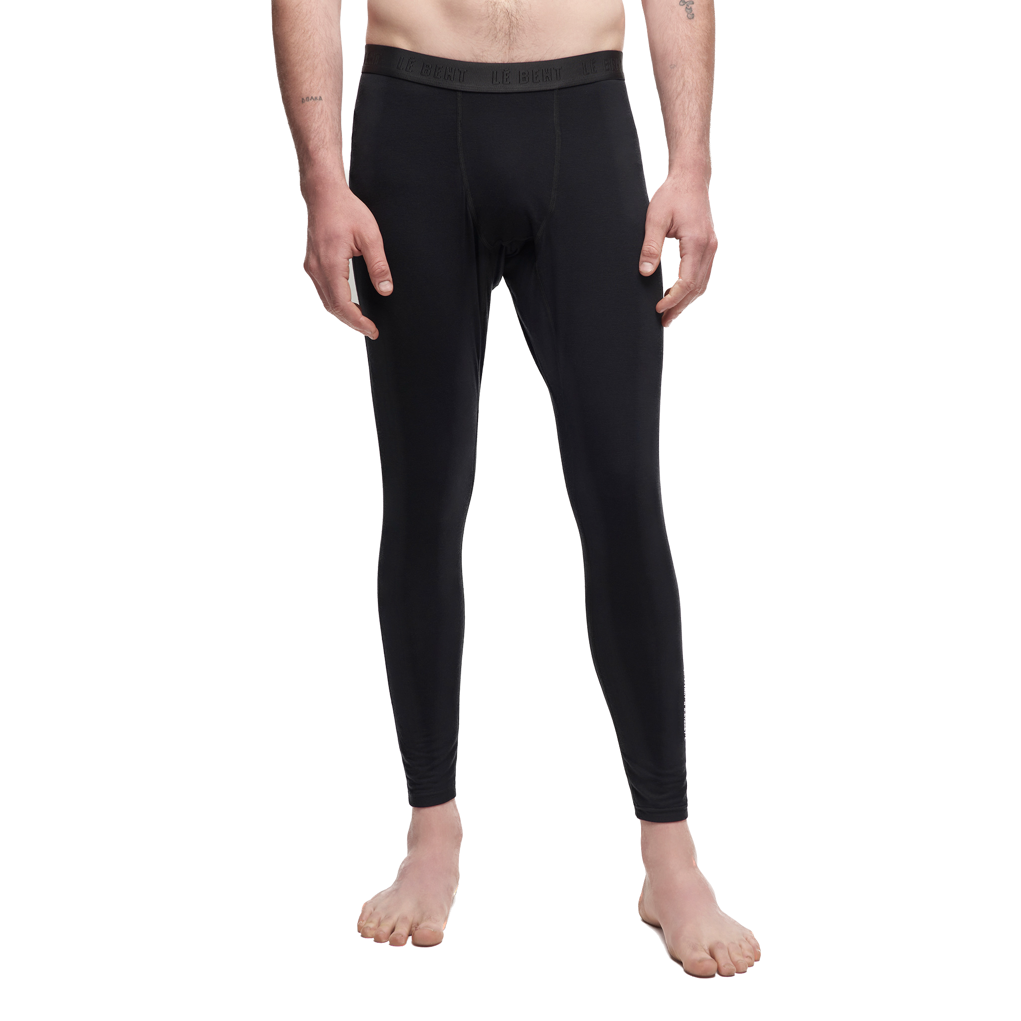 A pair of black Le Bent Men's Core Lightweight Baselayer Bottoms that are made from a bamboo and merino wool blend.