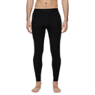 A man wearing a pair of Le Bent Men's Core Midweight Baselayer Bottoms that are made with a bamboo and merino wool blend.