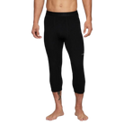 A man wearing a pair of black Le Bent Men's Core Midweight 3/4 Baselayer Bottoms that are made from a bamboo and merino wool blend.