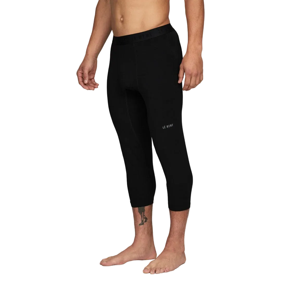 A pair of black Le Bent Men's Core Midweight 3/4 Baselayer Bottoms that are made from a bamboo and merino wool blend.