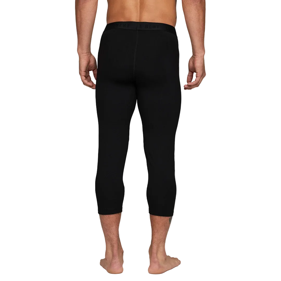 A pair of black Le Bent Men's Core Midweight 3/4 Baselayer Bottoms that are made from a bamboo and merino wool blend.