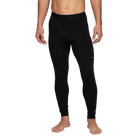 A man wearing a pair of Le Bent Men's Core Midweight Baselayer Bottoms that are made with a bamboo and merino wool blend.