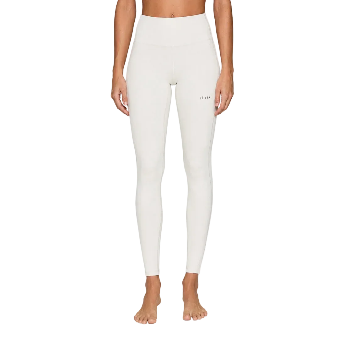 A pair of white Le Bent Women's Core Midweight Baselayer Bottoms that are made from a bamboo and merino wool blend.