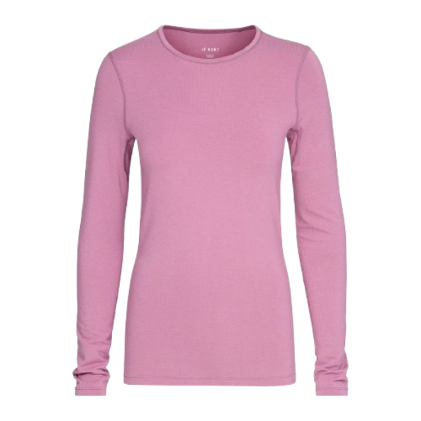 A pink Le Bent Women's Core Midweight Crewneck Baselayer Top that is made from a bamboo and merino wool blend.