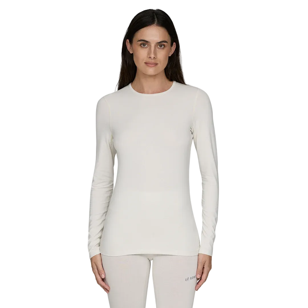 A white Le Bent Women's Core Midweight Crewneck Baselayer Top that is made from a bamboo and merino wool blend.