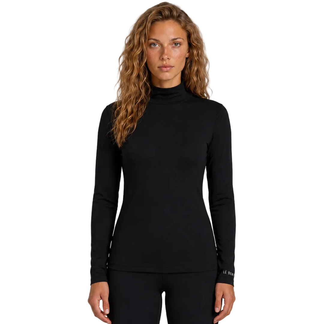 Front view of the Le Bent Women’s Midweight Mock Neck Baselayer Top featuring a bamboo-merino blend knit, fitted mock neck collar, flatlock stitching, and integrated thumb loops.