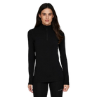 A woman wearing a black Le Bent Women's Midweight 1/4 Zip Turtleneck baselayer top that is made from a stretchable, breathable, premium bamboo and merino wool blend.