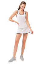 Lija Elite Axel Women's Tennis Skort featuring lightweight stretch performance fabric, built-in shorts, moisture-wicking comfort, and athletic styling.