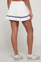 Lija Elite Banded Arena Women's Tennis Skort featuring lightweight stretch performance fabric, built-in shorts, moisture-wicking comfort, and athletic styling.