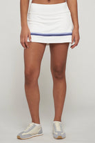 Lija Elite Banded Arena Women's Tennis Skort featuring lightweight stretch performance fabric, built-in shorts, moisture-wicking comfort, and athletic styling.