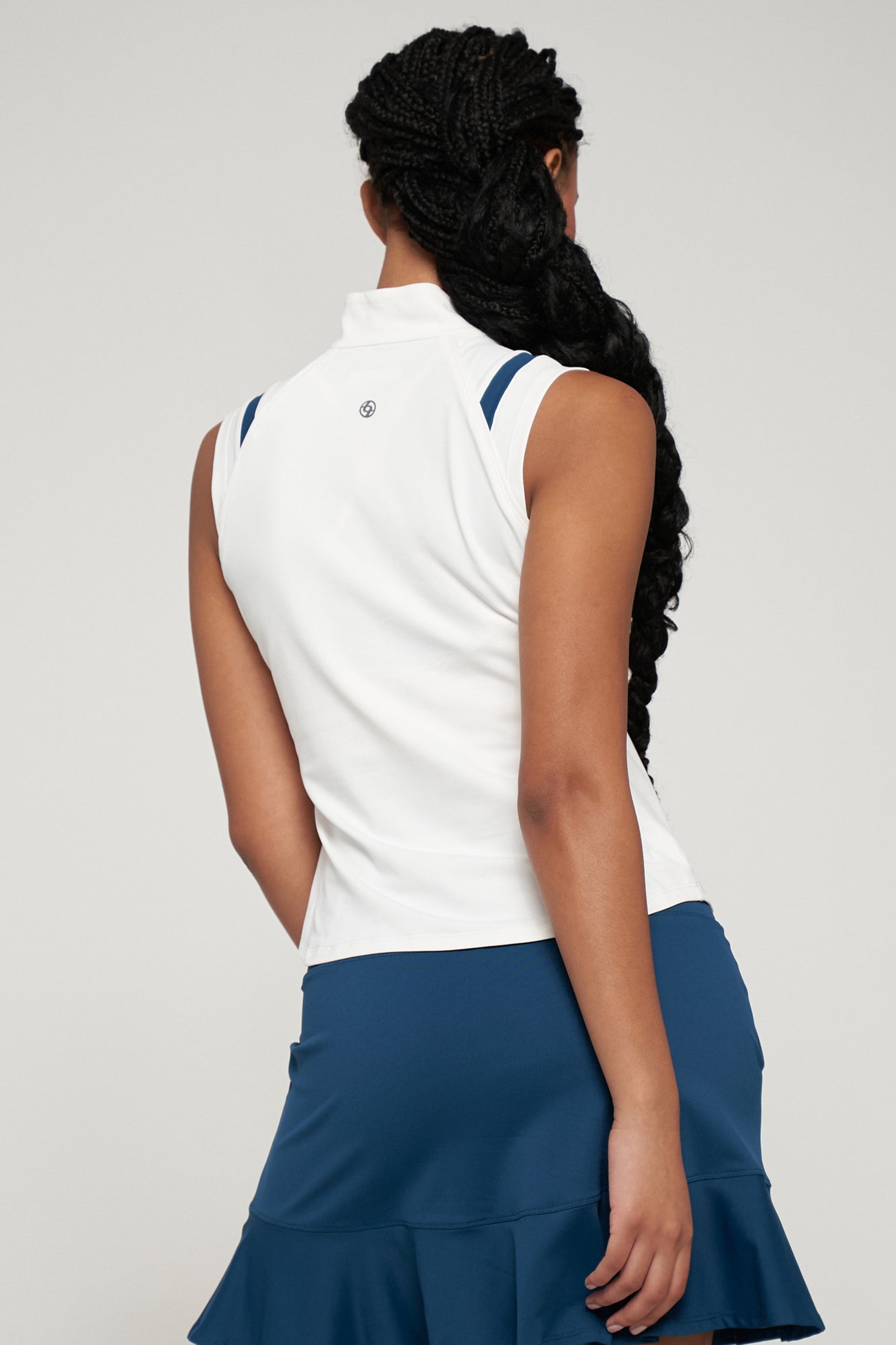 Lija Elite Fluid Women's Tennis Top featuring lightweight performance fabric, moisture-wicking comfort, breathable construction, and athletic styling.