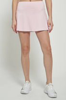 Lija Elite Patina Women's Tennis Skort featuring lightweight stretch performance fabric, built-in shorts, moisture-wicking comfort, and athletic styling.