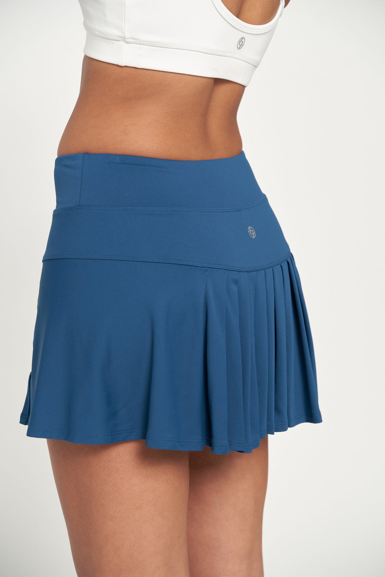 Lija Elite Step Women's Tennis Skort featuring lightweight stretch performance fabric, built-in shorts, moisture-wicking comfort, and athletic styling.