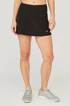 Lija Nevo Deuce Tennis Skort featuring stretch performance fabric, built-in shorts, moisture-wicking comfort, and athletic styling.