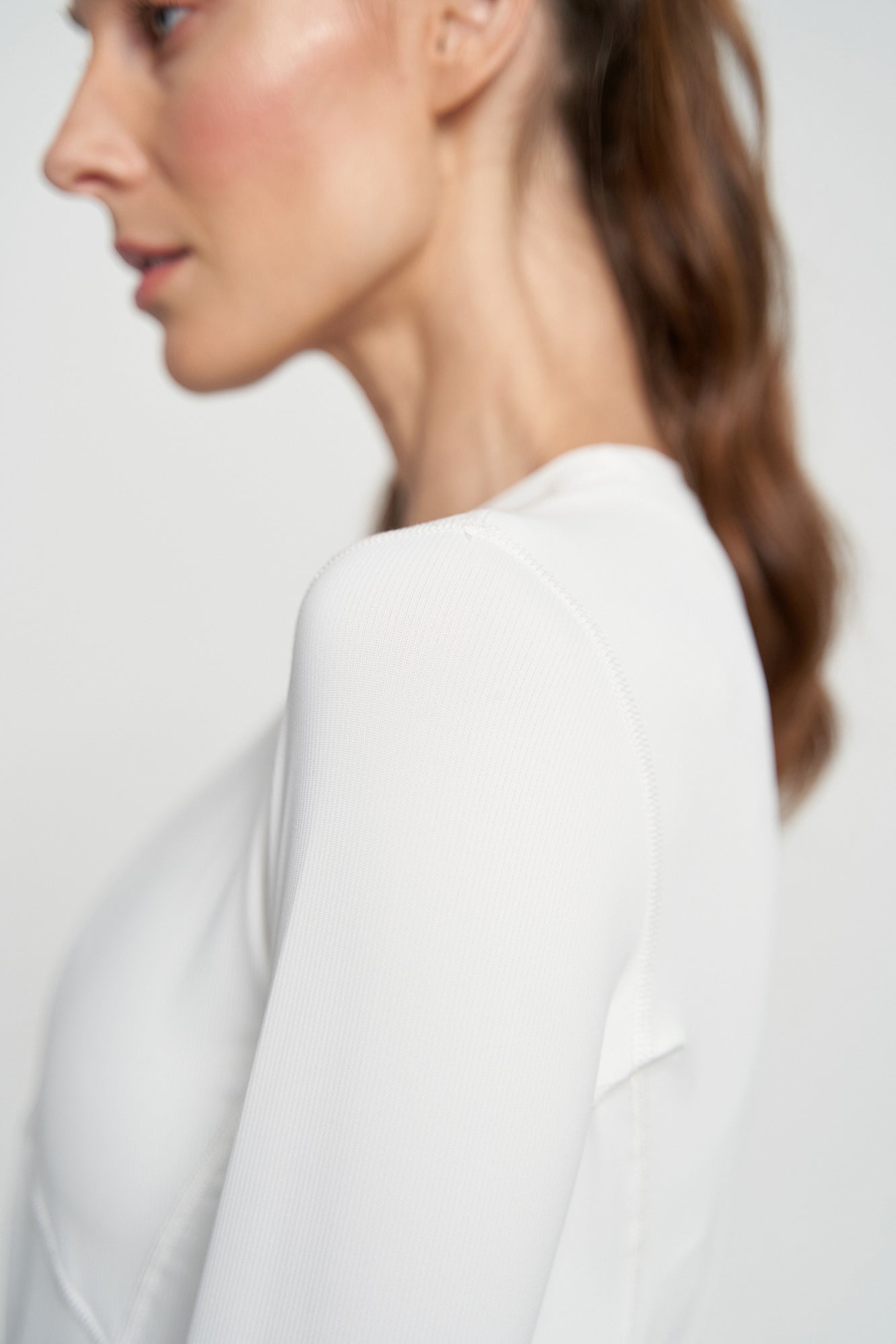 Lija Solar Titan Women's Tennis Top featuring lightweight performance fabric, moisture-wicking comfort, breathable construction, and athletic styling.