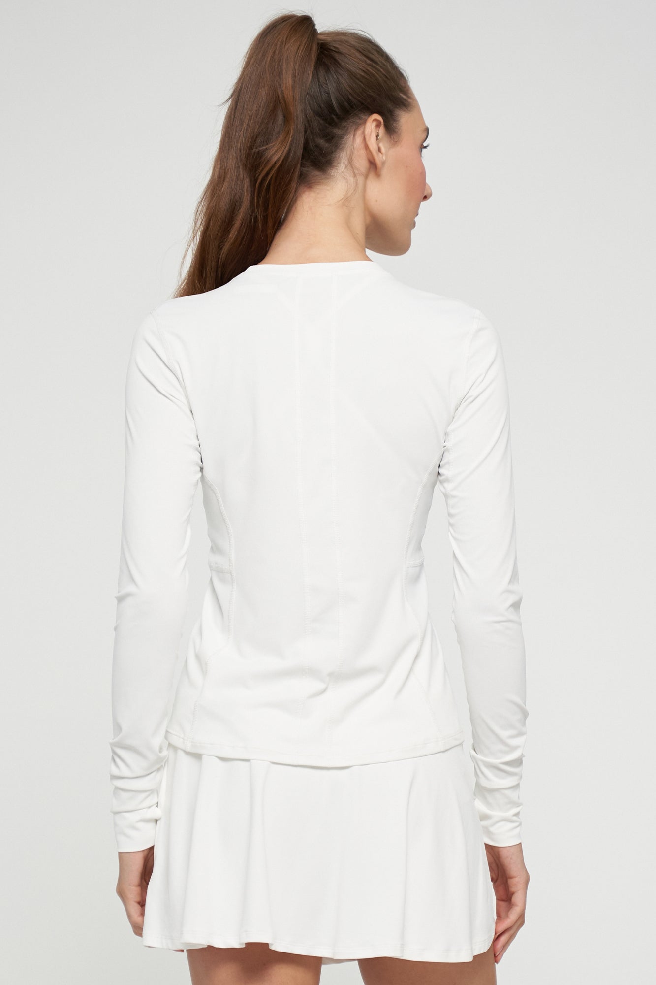 Lija Solar Titan Women's Tennis Top featuring lightweight performance fabric, moisture-wicking comfort, breathable construction, and athletic styling.