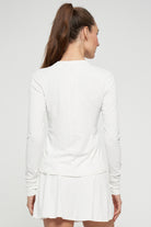 Lija Solar Titan Women's Tennis Top featuring lightweight performance fabric, moisture-wicking comfort, breathable construction, and athletic styling.