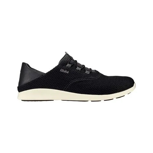 A black Olukai Mens 'Alapa Li Shoe featuring a collapsible heel on a white background
