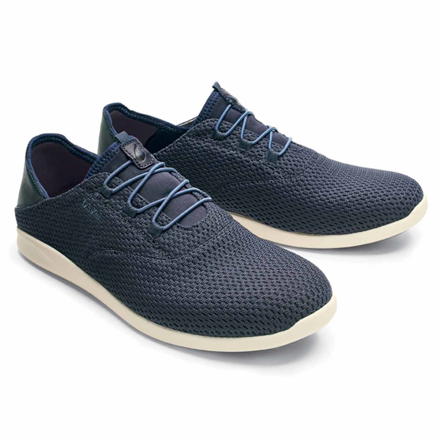 A pair of black Olukai Mens 'Alapa Li Shoes on a white background