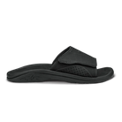 Black Olukai Men's Nalu Slide sandal with a strap on a white background
